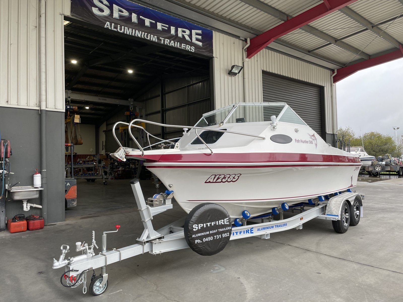 Fish-Hunter-585-on-Spitfire-700-2000-Aluminium-Trailer-scaled